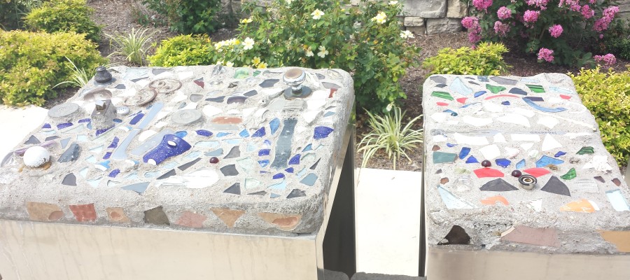 Stones next to the Plaque made from debris found in the cleanup