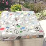 Stones next to the Plaque made from debris found in the cleanup
